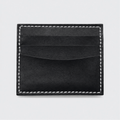 Porta carte Tessora in pelle con scomparto per carte di credito, design compatto e elegante, visualizzato in primo piano.