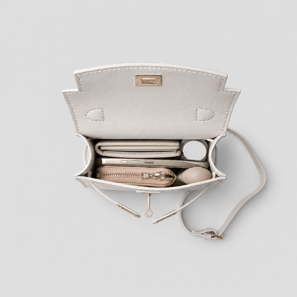 Borsa Tessora Luise in tessuto con manici in pelle, dettagli eleganti e design classico, vista frontale della borsa.