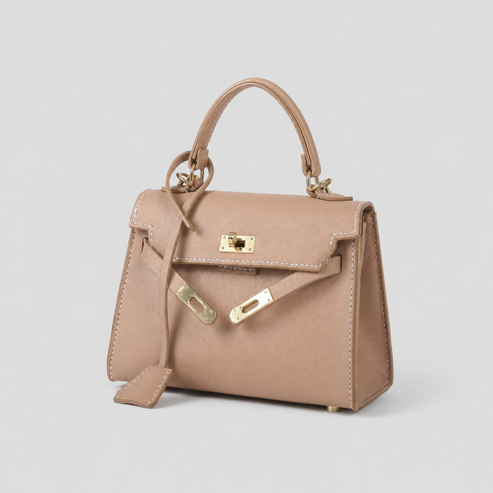 Borsa Luise di Tessora, elegante e moderna, con dettagli in pelle e manico a spalla, visibile in primo piano.